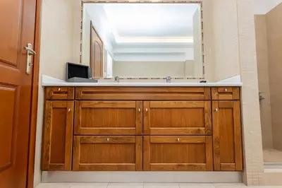 a bathroom with a sink and a mirror at Olive Grove Villa in Koropíon