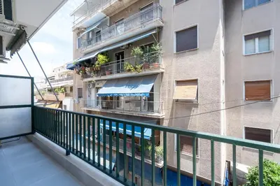 a balcony of a building with plants on the balconies at 2BR Family Apartment With Playroom-Arcade, 2 Bathrooms & 2 Kitchens in Athens