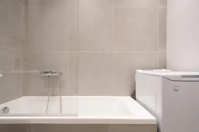 a bathroom with a shower with a toilet and a sink at 2BR Family Apartment With Playroom-Arcade, 2 Bathrooms & 2 Kitchens in Athens