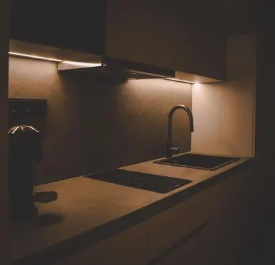 a kitchen with a sink and a counter with a light at Aura and Luxury in Athens