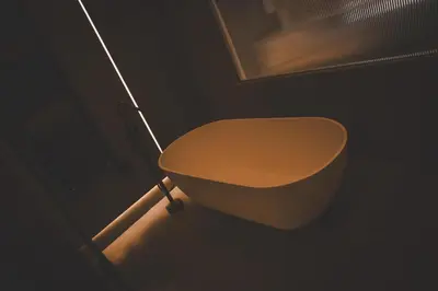 a bathroom with a toilet in a dark room at Aura and Luxury in Athens
