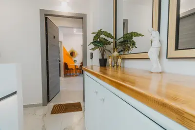 a kitchen with a wooden counter with a statue on it at Calmio Athens 2 in Athens