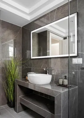a bathroom with a sink and a mirror at Majestique South Riviera Residence in Athens
