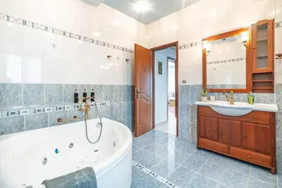 a bathroom with a tub and a sink at Luxury, entire, 2-10 person apartment in ilioupoli in Athens