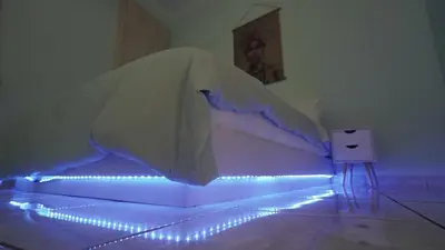 a bedroom with a bed with lights on it at Maria's Ethereal Place in Athens