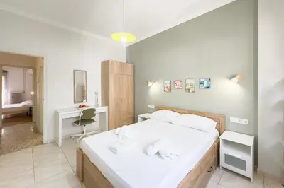 a bedroom with a bed and a desk in it at Comfort Athens Apartment near Metro Station in Athens