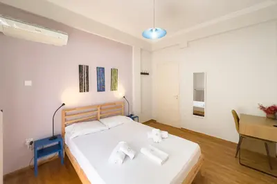 a bedroom with a bed with towels on it at Comfort Athens Apartment near Metro Station in Athens