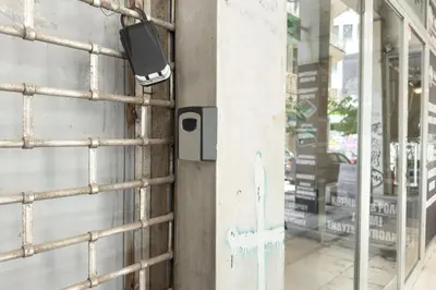 a security camera on the side of a building at City Beat Athens Studio in Athens