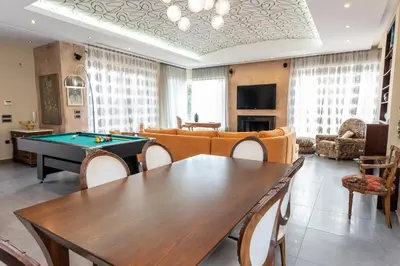 a living room with a ping pong table at Vasso Villa in Vravrona