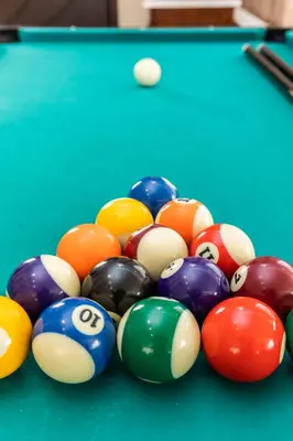 a group of billiard balls on a pool table at Vasso Villa in Vravrona