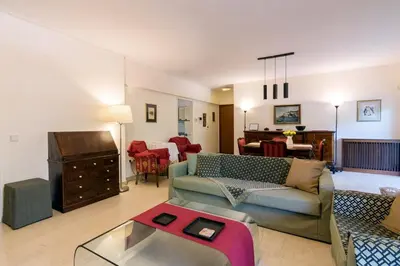 a living room with a couch and a table at Seaside Apartment in Palaio Faliro in Athens
