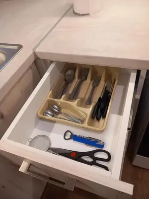 a drawer with scissors and other kitchen utensils at Αpt in Gazi in front of metro in Athens