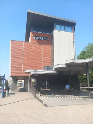 a building with a sign on top of it at Αpt in Gazi in front of metro in Athens