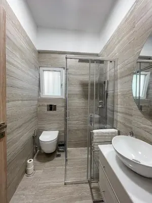 a bathroom with a shower and a toilet and a sink at Ridis Studio Athens in Athens