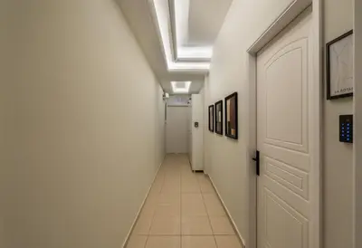 a hallway with white walls and a ceiling at Acropolis Atelier, Plunge Pool Apartments in Athens