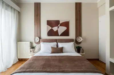 a bedroom with a large bed with white pillows at Acropolis Atelier, Plunge Pool Apartments in Athens