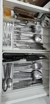 a refrigerator filled with lots of silver utensils at Casa Esmeralda Faliro in Athens