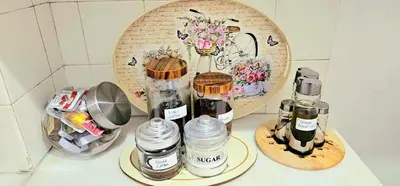 a counter top with three bottles of coffee on it at Casa Esmeralda Faliro in Athens