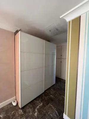 an empty room with a large white closet at Apartment Glyfada Athens at One o One Seven, bright and spacious apartment located on the first floor with no elevator in Athens