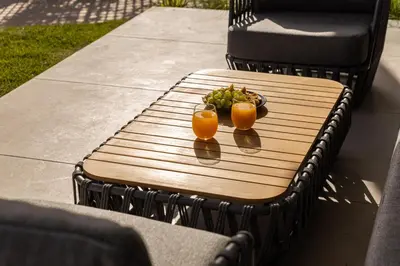 two glasses of orange juice and a plate of fruit on a table at Anlijors Premium Residency in Kalívia Thorikoú