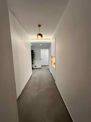an empty hallway with white walls and a ceiling at Elizabeth's in Athens