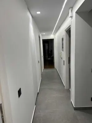 a hallway with white walls and a hallway with at Elizabeth's in Athens