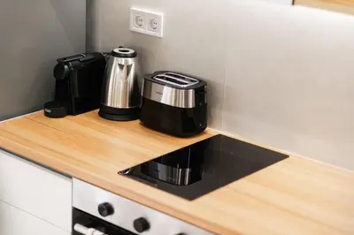 a coffee maker on a counter in a kitchen at Studio Garden next to Metro station in Piraeus