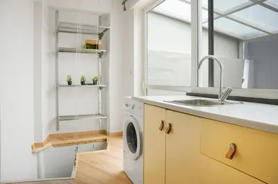 a kitchen with a sink and a washing machine at Athens Apartment on Lycabettus Hill with Rooftop View Access in Athens