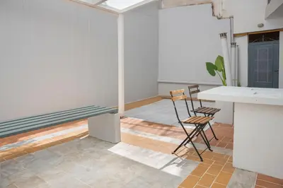 an empty room with a table and two chairs at Athens Apartment on Lycabettus Hill with Rooftop View Access in Athens