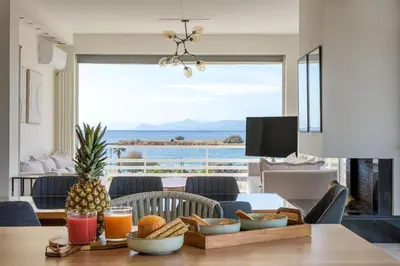 a dining room with a table with a pineapple on it at 3 Bedroom Apartment in Glyfada in Athens