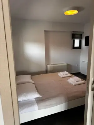 a bedroom with a bed with two towels on it at The Artist House - Best Sea View in Porto Rafti in Porto Rafti