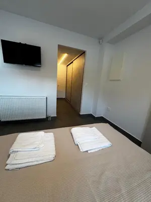 two white towels sitting on a bed in a room at The Artist House - Best Sea View in Porto Rafti in Porto Rafti