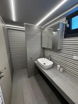 a bathroom with a sink and a mirror at The Artist House - Best Sea View in Porto Rafti in Porto Rafti