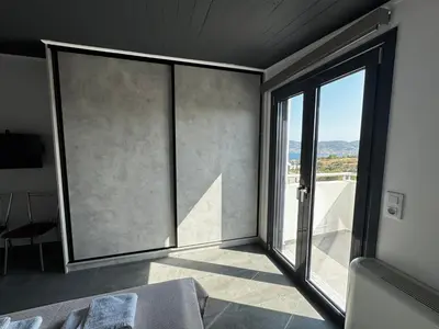 a room with a large window with a view at The Artist House - Best Sea View in Porto Rafti in Porto Rafti