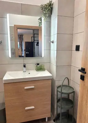 a bathroom with a sink and a mirror at National Garden and Panathenaic Stadium area Moden Cozy Studio A in Athens