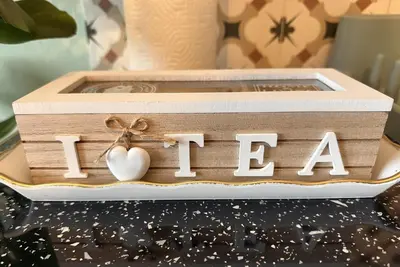 a wooden box with the word i love with a heart at National Garden and Panathenaic Stadium area Moden Cozy Studio A in Athens