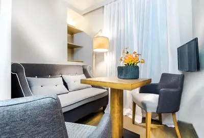 a living room with a couch and a table at Comfort studio in Kolonaki 2 in Athens
