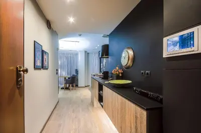 a kitchen with a counter and a sink in a room at Comfort studio in Kolonaki 2 in Athens