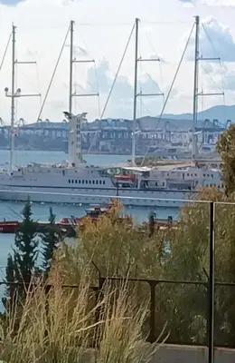 a large cruise ship docked in a harbor at 