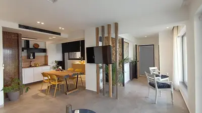 a kitchen and dining room with a table and chairs at 