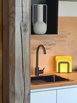 a kitchen with a sink and aaucet at 