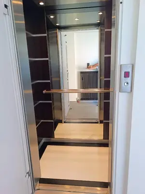 a walk in closet with a glass door at 