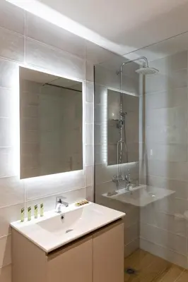 a bathroom with a sink and a shower and a mirror at Urban Athens - Studio #1 in Athens