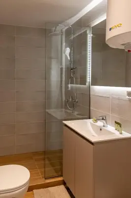 a bathroom with a toilet and a sink and a shower at Urban Athens - Studio #3 in Athens