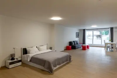a bedroom with a bed and a living room at Urban Athens - Studio #4 in Athens