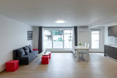 a living room with a couch and a table at Urban Athens - Studio #4 in Athens