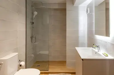 a bathroom with a shower and a toilet and a sink at Urban Athens - One Bedroom in Athens