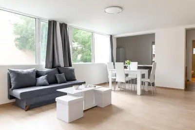 a living room with a couch and a table at Urban Athens - Two Bedroom #7 in Athens