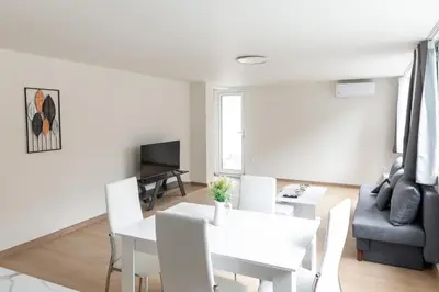 a living room with a white table and chairs at Urban Athens - Two Bedroom #7 in Athens