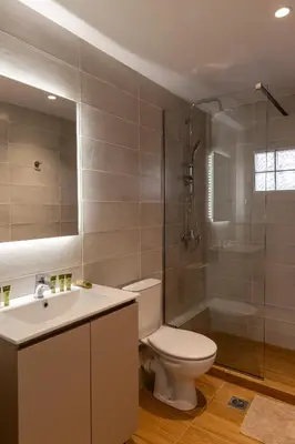 a bathroom with a toilet and a shower and a sink at Urban Athens - Two Bedroom #7 in Athens